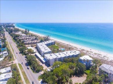 Just Steps to the Sandy Beach from this Two Bedroom Condo